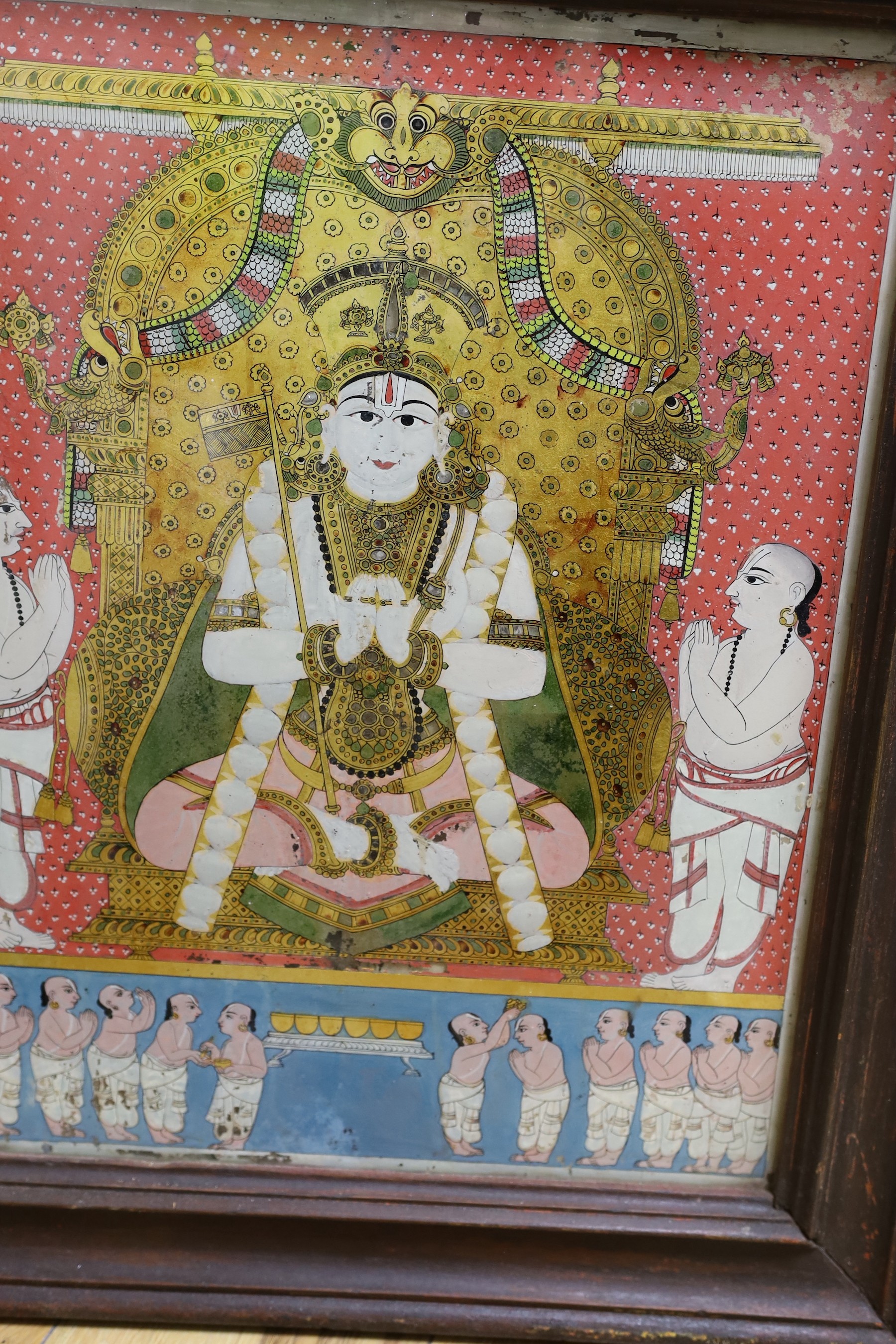 A collection of eight Indian reverse decorated glass pictures, 20th century, largest frame 70cm X 60cm